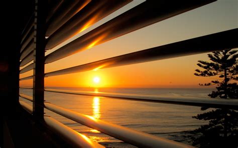 View of the sunset through the blinds wallpapers and ...
