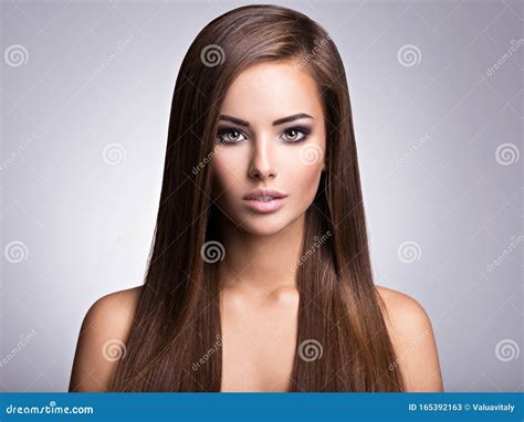 Portrait Of Beautiful Young Woman With Long Straight Brown Hair Stock