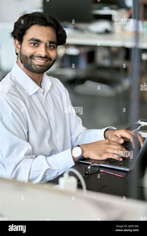 Happy Indian Young Business Man Employee Working On Laptop Portrait