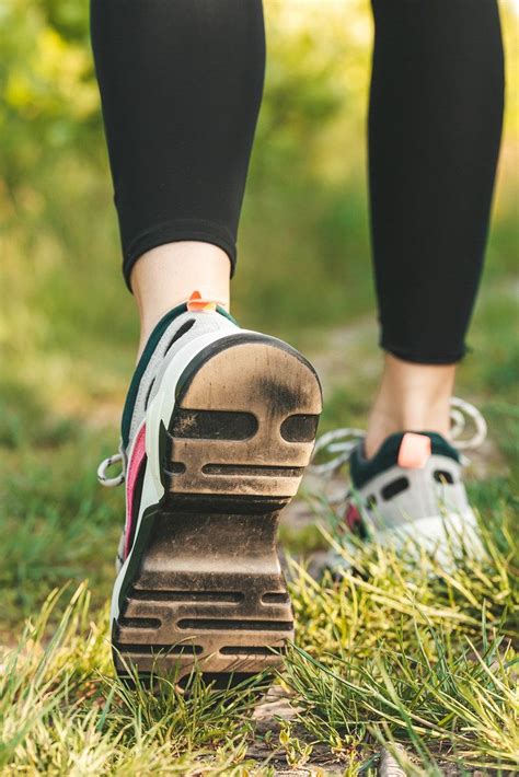 Runner Woman Feet Running On Road Closeup On Shoe Sports Healthy