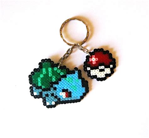 The Pixel Keychain Is Made To Look Like An Old Video Game Character