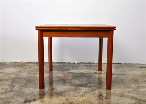 The seats are made of solid teak with an oil and rustic finish, making them durable and moisture resistant. SELECT MODERN: Danish Modern Teak Expandable Dining Room Table