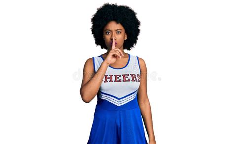 Young African American Woman Wearing Cheerleader Uniform Asking To Be