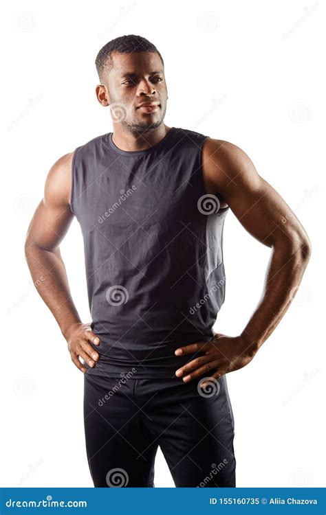Confident Handsome Young African Man Standing With Hands On The Hips