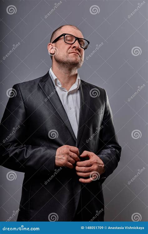 Provocative Fun Bald Business Man Looking Serious In Eyeglasses In Suit