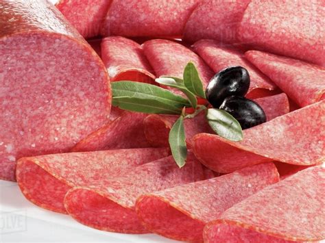 Sliced Salami And Olives Stock Photo Dissolve