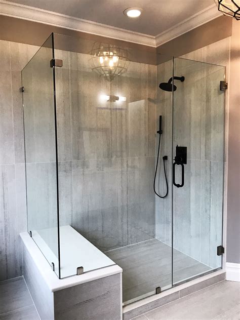 frameless shower enclosure with notched in line panel and buttress return to accommodate seat