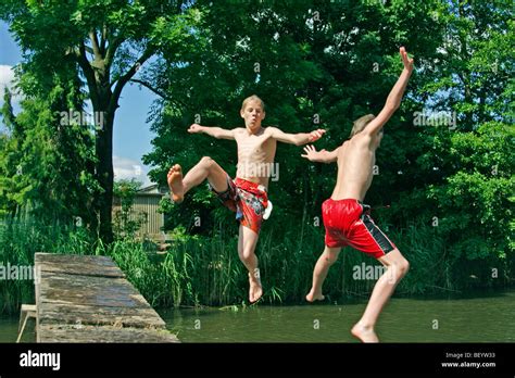 Teenage Boys Bathing In A River Stock Photo Alamy