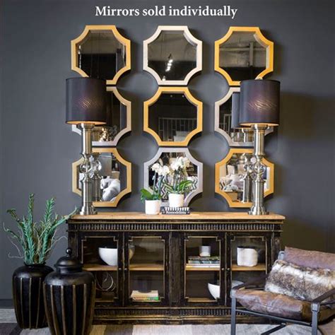 Perfect to go above a console table in a rustic or modern setting, this accent mirror is mounted in an iron frame. Mattingly Octagonal Accent Wall Mirror