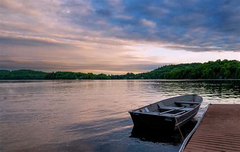 Rowboat Docked In A Lake At Sunset Photograph By John Twynam Fine Art America