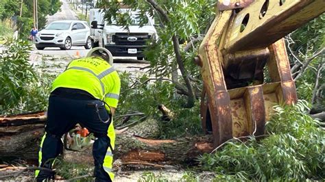 How To Stay Safe Amongst Storm Damage Crews Work To Clear Streets In