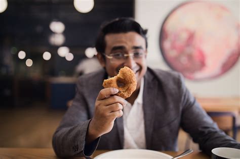 Man Holding Donut Free Stock Photo - NegativeSpace