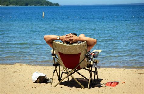 Man Relaxing On Beach Stock Photo Image Of Water Lake 14816298