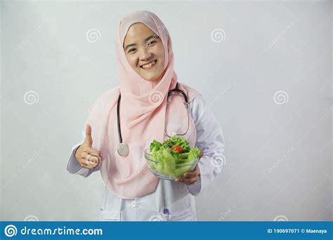 Asian Beautiful Young Muslim Woman Doctor In Hijab Dress With
