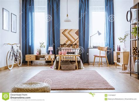 Wood, steel and a soft grey finish shine a light on streamlined task lighting. Feminine bedroom with desk stock image. Image of cupboard - 113740557