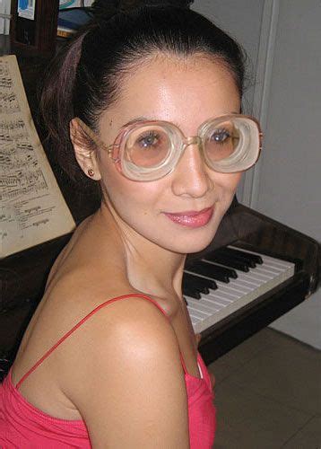 Cute Black Haired Girl At Piano Wearing Big Strong Glasses