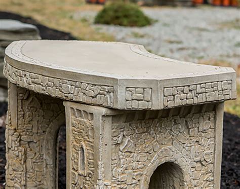 The seat and back slats made of durable wood offer great support and the ergonomic curved design of the jasper gives this bench both beautiful form and function. 34" Concrete Curved Garden Bench