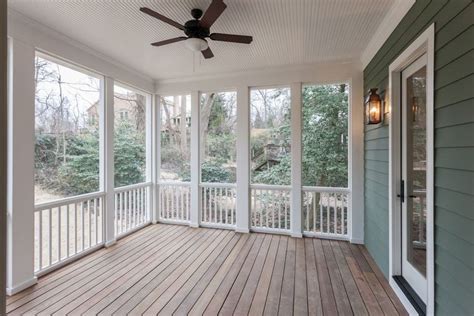 Covered Screened In Porch With White Bead Board Ceiling At Custom Home