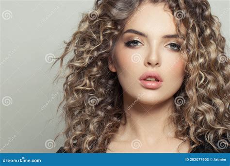 Attractive Young Model Woman With Curly Hair On White Fashion Beauty Portrait Stock Image