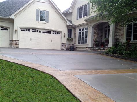 Gray Concrete Driveway With Tan Colored Seamless Stamped Borders And