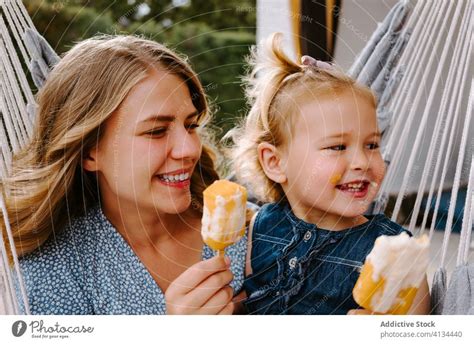 Happy Little Girl And Woman With Homemade Popsicles A Royalty Free