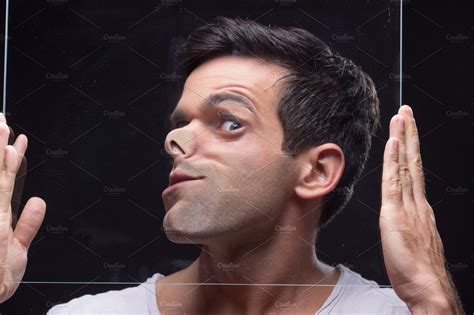 Man Pressed Against Glass Bizarre Stock Photo Containing Young Adult