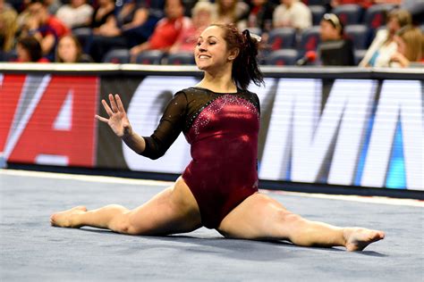 University Of Denver Gymnast Maggie Laughlin Smiles While Holding The Splits During Her Floor