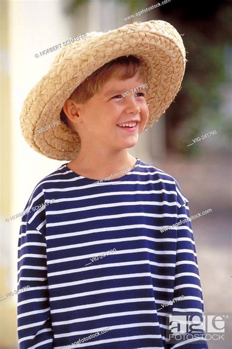 Portrait Outdoor Laughing Blond 6 Year Old Boy Wearing Blue White