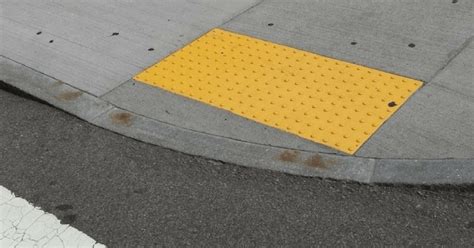 Heres What Those Yellow Dots On The Sidewalk Are Really For
