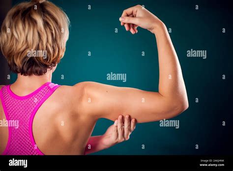 Woman With Fit Arm Showing Triceps And Bicep People Fitness And