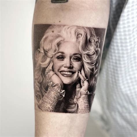 Micro Realistic Dolly Parton Portrait Tattoo Located On