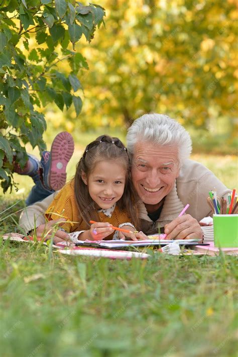 Premium Photo Grandfather And Granddaughter Drawing