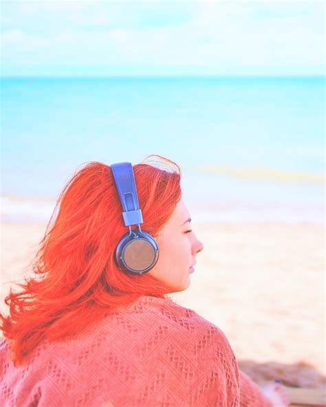 Premium Photo Redhead Sexy Woman Listening To Music On The Beach Amazing Woman On Break In