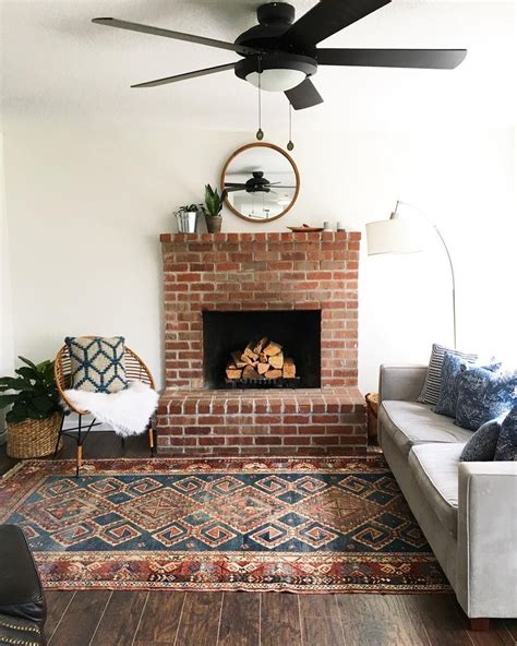 Grey sofa rug ideas, what is the best color area rug for an off white couch. Vintage Turkish rug, grey sofa, brick fireplace | Turkish rug living room, Vintage turkish rugs ...