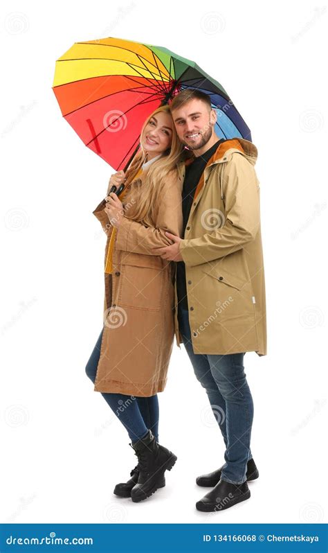 Full Length Portrait Of Beautiful Couple With Umbrella Stock Photo