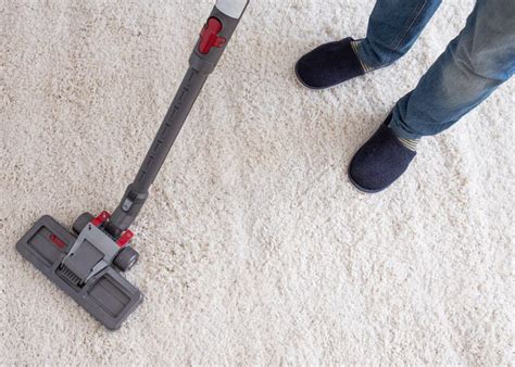 Using Vacuum Cleaner And Cleaning The Carpet Stock Photo Image Of