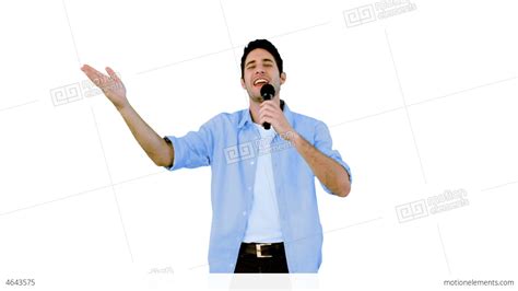 Man Singing Into Microphone On White Background Stock Video Footage