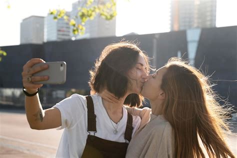 Free Photo Adorable Lesbian Couple Kissing Outdoors