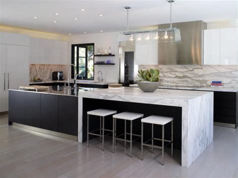 Modern kitchen sink with metal tap and black marble. Modern Black and White Kitchen With Marble Countertops | HGTV