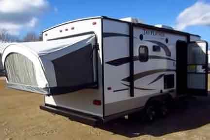 Rear bench slides out into a bed with and overhead sleeping compartment. Hybrid Pop-up Campers