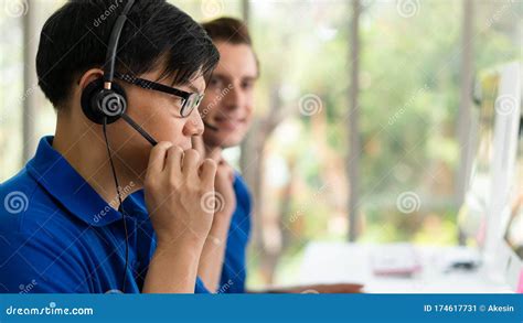 Business Background Of Asian And Caucasian Male Customer Service Agents