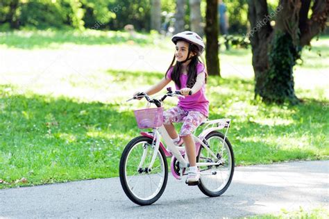 The Girl Is Riding A Bike