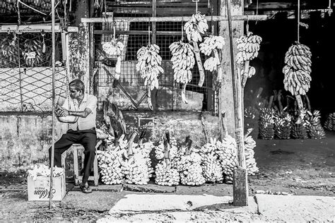 Ols Man In A Fruit Market In Asia Photograph By Martina Pellecchia