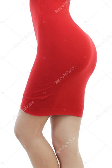 Beautiful Young Woman In A Tight Red Dress Isolated On A White