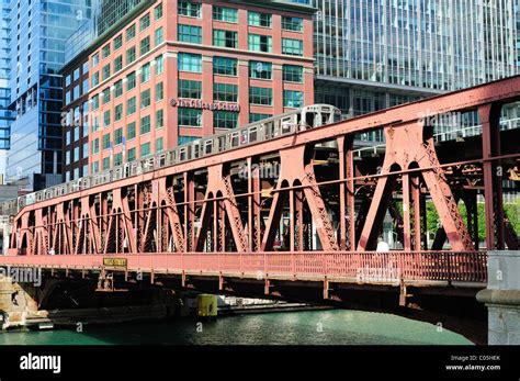 A Cta Brown Line Elevated Train Crosses The Chicago River On The Wells