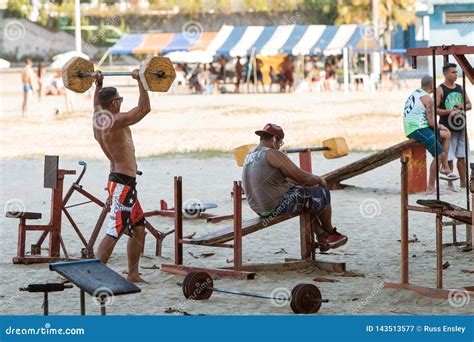 Men Lift Weights With Crude Equipment At Outdoor Brazil Gym Editorial