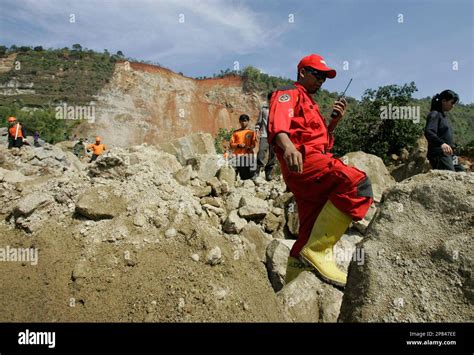Rescue Workers Search For Victims At The Site Where An Earthquake