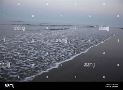 Waves Rushing Over Sand Stock Photo Alamy