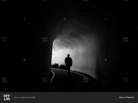Man Walking In Tunnel In Black And White Stock Photo Offset