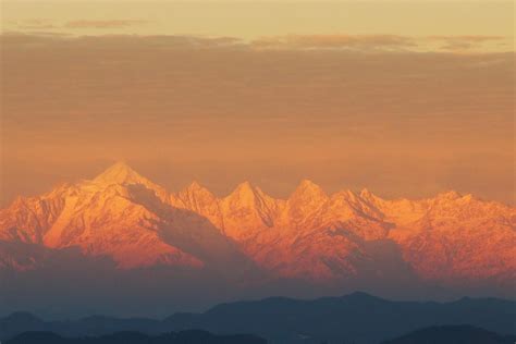 Himalaya Stands Apart In The Golden Hour While Mist Shrouds The Lesser